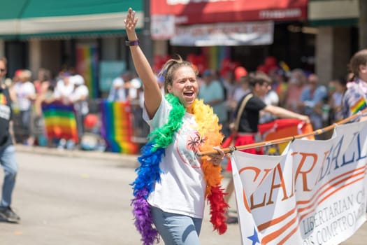 Chicago, Illinois, USA - June 24, 2018  woman supporting the libertarian party during the LGBTQ Pride Parade in Chicago