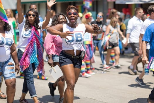 Chicago, Illinois, USA - June 24, 2018 People promoting J. B. Pritzker for governor during the LGBTQ Pride Parade in Chicago