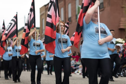 Holland, Michigan, USA - May 12, 2018 Members of the West Ottawa High School Marching Band, Holland MI, perform at the Muziek Parade, during the Tulip Time Festival