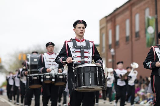 Holland, Michigan, USA - May 12, 2018 Members of the Arlington High School All Brass Marching Band perform at the Muziek Parade, during the Tulip Time Festival