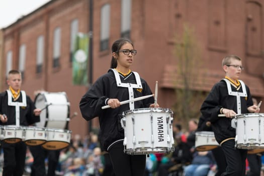 Holland, Michigan, USA - May 12, 2018 Members of the Hamilton Middle School marching band perform at the Muziek Parade, during the Tulip Time Festival