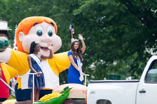 Washington, D.C., USA - July 4, 2018, The National Independence Day Parade, group of beauty queens on a float going down constitution avenue