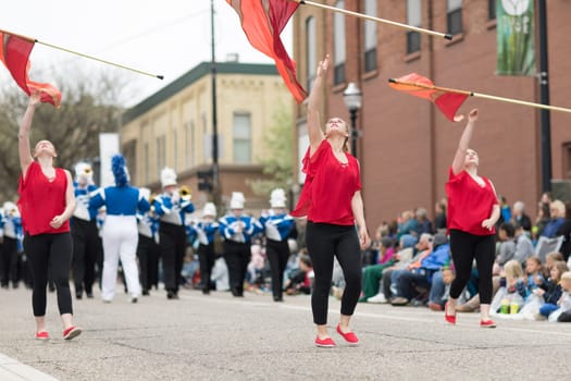 Holland, Michigan, USA - May 12, 2018 Members of the merrill high school marching jays perform at the Muziek Parade, during the Tulip Time Festival