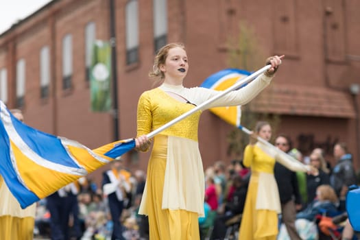 Holland, Michigan, USA - May 12, 2018 Members Columbia Central H.S. Golden Eagles Marching Band at the Muziek Parade, during the Tulip Time Festival