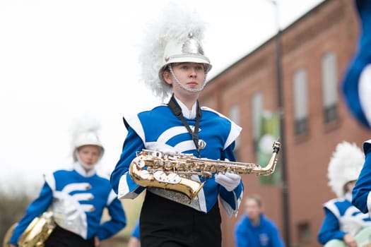 Holland, Michigan, USA - May 12, 2018 Members of the merrill high school marching jays perform at the Muziek Parade, during the Tulip Time Festival