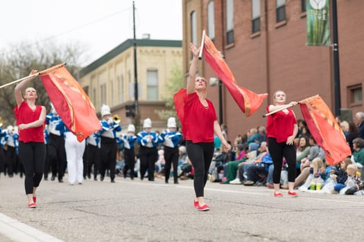 Holland, Michigan, USA - May 12, 2018 Members of the merrill high school marching jays perform at the Muziek Parade, during the Tulip Time Festival