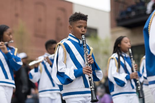 Holland, Michigan, USA - May 12, 2018 Members of the Calvin Christian School Marching Band at the Muziek Parade, during the Tulip Time Festival