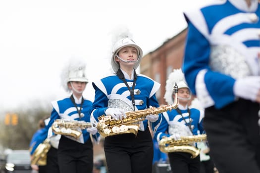 Holland, Michigan, USA - May 12, 2018 Members of the merrill high school marching jays perform at the Muziek Parade, during the Tulip Time Festival