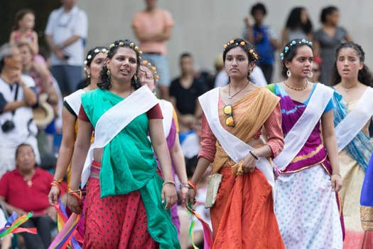Washington, D.C., USA - July 4, 2018, The National Independence Day Parade, Indian women, dancers, wearing traditional clothing, going down constitution avenue