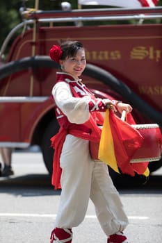 Washington, D.C., USA - July 4, 2018, The National Independence Day Parade, Chinese, wearing traditional clothing, playing drums, going down constitution avenue during the parade