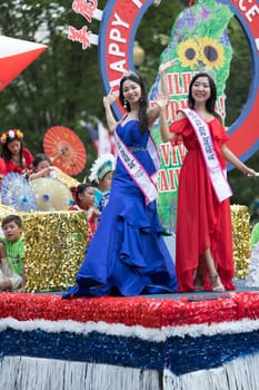 Washington, D.C., USA - July 4, 2018, The National Independence Day Parade, Taiwanese beauty queens on a float, going down constitution avenue during the parade