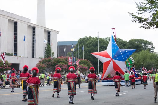 Washington, D.C., USA - July 4, 2018, The National Independence Day Parade, Taiwanese women wearing traditional clothing, walking down constitution avenue during the parade