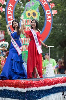 Washington, D.C., USA - July 4, 2018, The National Independence Day Parade, Taiwanese beauty queens on a float, going down constitution avenue during the parade