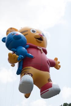 Washington, D.C., USA - July 4, 2018, The National Independence Day Parade, Balloon in shape of Daniel Tiger, going down constitution avenue