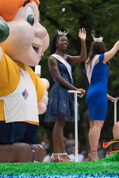 Washington, D.C., USA - July 4, 2018, The National Independence Day Parade, Group of beauty queens on a float going down constitution avenue