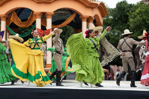 Matamoros, Tamaulipas, Mexico - November 20, 2018: The November 20 Festival, Young men and women wearing traditional mexican clothing, perform traditional mexican dances at the Plaza Miguel Hidalgo.