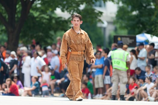 Washington, D.C., USA - July 4, 2018, The National Independence Day Parade, Man dress up as Tonto, lone Ranger character, walking down constitution avenue