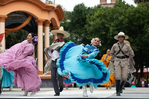 Matamoros, Tamaulipas, Mexico - November 20, 2018: The November 20 Festival, Young men and women wearing traditional mexican clothing, perform traditional mexican dances at the Plaza Miguel Hidalgo.