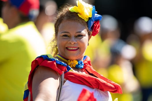 Washington, D.C., USA - September 29, 2018: The Fiesta DC Parade, Colombian woman wearing traditional colombian clothing dancing