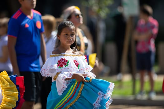 Washington, D.C., USA - September 29, 2018: The Fiesta DC Parade, Colombian girl wearing traditional clothing dancing