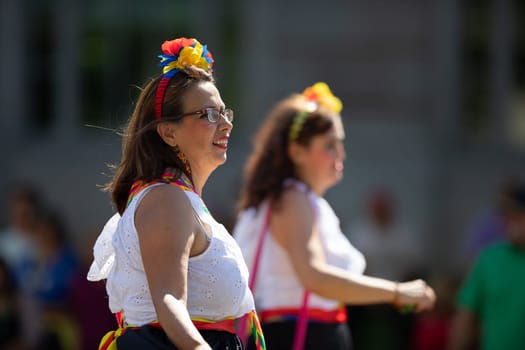 Washington, D.C., USA - September 29, 2018: The Fiesta DC Parade, Colombian woman wearing traditional colombian clothing dancing