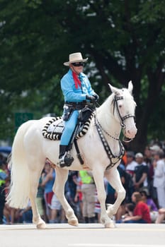Washington, D.C., USA - July 4, 2018, The National Independence Day Parade, Man dress up as the Lone Ranger, riding a horse down constitution avenue
