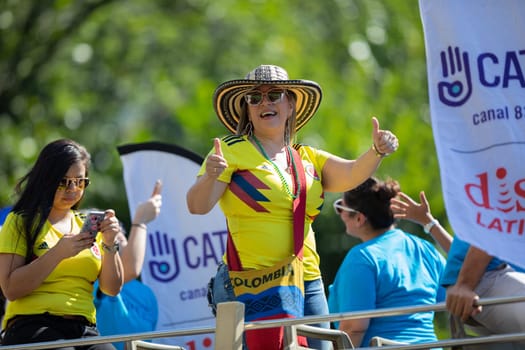Washington, D.C., USA - September 29, 2018: The Fiesta DC Parade, Woman from Colombia wearing the national football team shirt