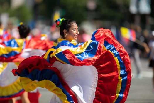 Washington, D.C., USA - September 29, 2018: The Fiesta DC Parade, Young women wearing traditional ecuadorian clothing dancing