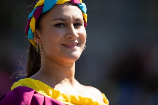 Washington, D.C., USA - September 29, 2018: The Fiesta DC Parade, Colombian woman wearing traditional colombian clothing dancing