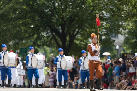 Washington, D.C., USA - July 4, 2018, The National Independence Day Parade, Falun Dafa chinese marching band, wearing traditional clothing, marching down constitution avenue