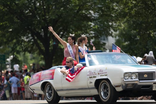 Washington, D.C., USA - July 4, 2018, The National Independence Day Parade, Miss Maryland riding on the back of a car, going down constitution avenue