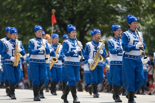 Washington, D.C., USA - July 4, 2018, The National Independence Day Parade, Falun Dafa chinese marching band, wearing traditional clothing, marching down constitution avenue