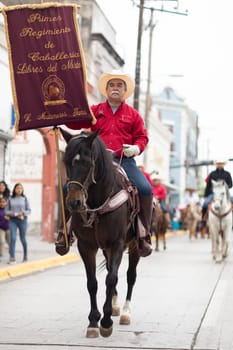 Matamoros, Tamaulipas, Mexico - November 20, 2018: The November 20 Parade, Men wearing traditional mexican clothing riding horses during the parade