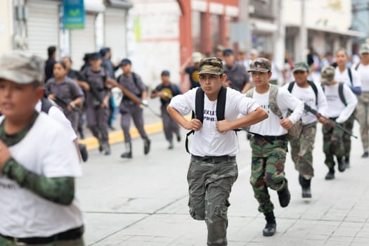 Matamoros, Tamaulipas, Mexico - November 20, 2018: The November 20 Parade, Members of the Pentathlon runing with rifles, and wearing military style uniforms
