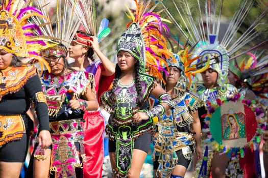 Washington, D.C., USA - September 29, 2018: The Fiesta DC Parade, Aztec dancers with traditional clothing perform at the parade