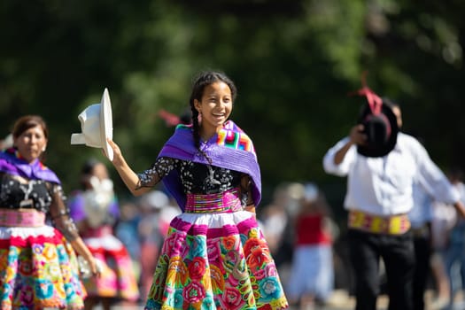 Washington, D.C., USA - September 29, 2018: The Fiesta DC Parade, Peruvian women wearing traditional clothing danicng during the parade