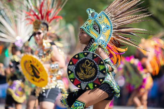 Washington, D.C., USA - September 29, 2018: The Fiesta DC Parade, Aztec dancers with traditional clothing perform at the parade