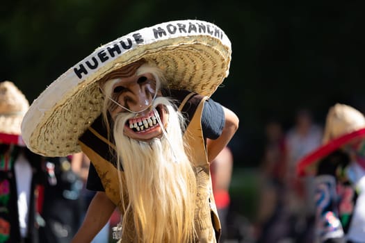 Washington, D.C., USA - September 29, 2018: The Fiesta DC Parade, Mexican man wearing an abstract face mask and a big sombrero