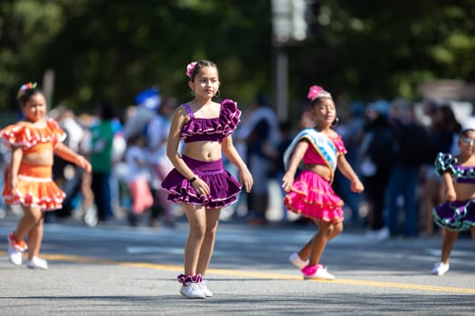 Washington, D.C., USA - September 29, 2018: The Fiesta DC Parade, peruvian girl wearing traditional clothing danicng during the parade