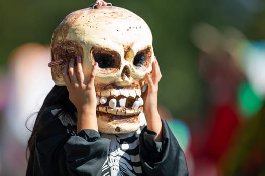 Washington, D.C., USA - September 29, 2018: The Fiesta DC Parade, MeXican girl dress up as a calabera, skeleton