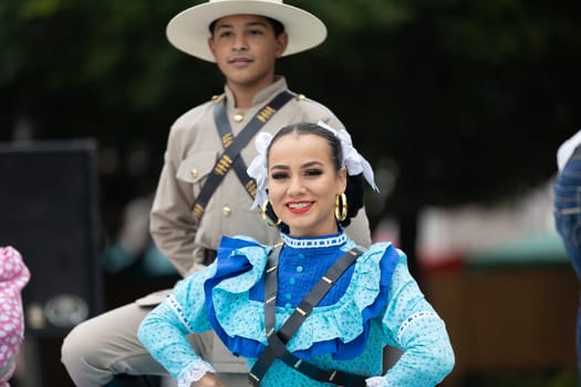 Matamoros, Tamaulipas, Mexico - November 20, 2018: The November 20 Festival, Young men and women wearing traditional mexican clothing, pose for the camera at the Plaza Miguel Hidalgo.