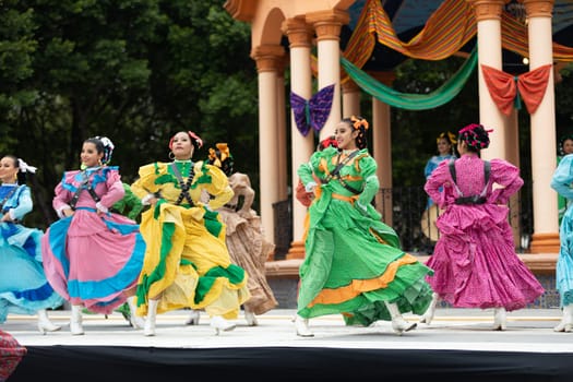 Matamoros, Tamaulipas, Mexico - November 20, 2018: The November 20 Festival, Young men and women wearing traditional mexican clothing, perform traditional mexican dances at the Plaza Miguel Hidalgo.