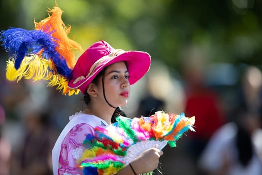 Washington, D.C., USA - September 29, 2018: The Fiesta DC Parade, Woman wearing traditional clothing from Nicaragua going down the street