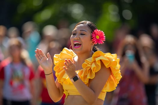 Washington, D.C., USA - September 29, 2018: The Fiesta DC Parade, peruvian woman wearing traditional clothing danicng during the parade