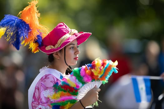 Washington, D.C., USA - September 29, 2018: The Fiesta DC Parade, Woman wearing traditional clothing from Nicaragua going down the street