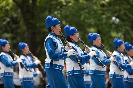 Washington, D.C., USA - July 4, 2018, The National Independence Day Parade, Falun Dafa chinese marching band, wearing traditional clothing, marching down constitution avenue