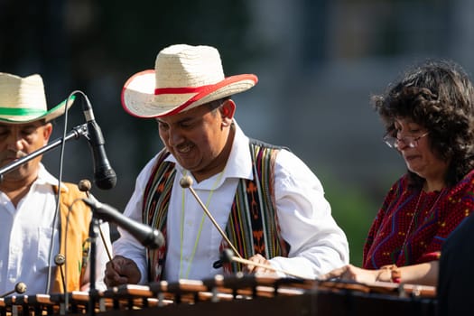 Washington, D.C., USA - September 29, 2018: The Fiesta DC Parade, Man from Guatemala wearing traditional clothing playing the Xylophone
