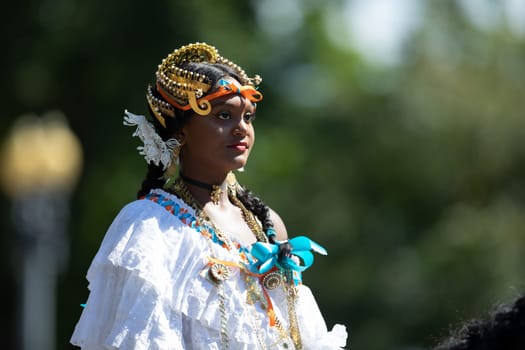 Washington, D.C., USA - September 29, 2018: The Fiesta DC Parade, Woman wearing traditional Panamanian clothing riding a horse