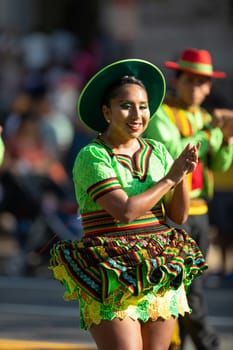 Washington, D.C., USA - September 29, 2018: The Fiesta DC Parade, Bolivian women wearing traditional clothing performing a traditional dance from bolivia