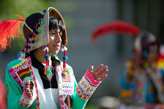 Washington, D.C., USA - September 29, 2018: The Fiesta DC Parade, young man from bolivia wearing traditional clothing walking down the street during the parade